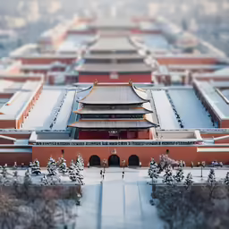 a snow covered picture of a small asian building