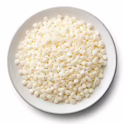 white food on a plate with white background