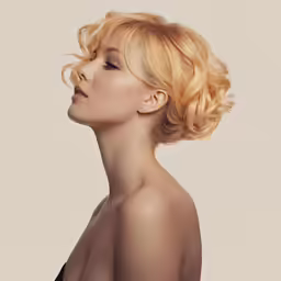 an image of a lady with her hair in a wavy hairstyle