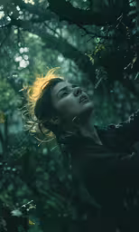 a woman in the forest stares at something in the air