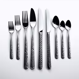 five forks, five knives, four knives, six knives and a spoon
