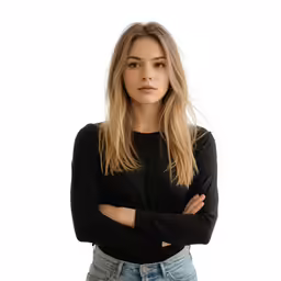 a young woman in a black shirt and jeans posing for the camera