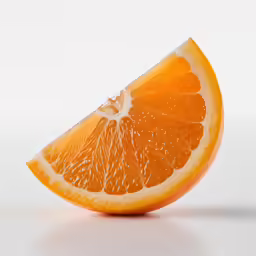 an orange sliced in half and placed on a table