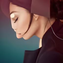 a woman with her eyes closed is looking down
