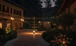 an entrance way with some lights hanging above the entrance