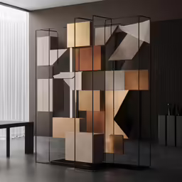 a table with a chair in front of an artistic wall