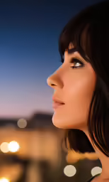 a woman with very long hair and a short bangs stares over her shoulder