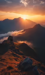 a beautiful sunrise over the mountains with mist