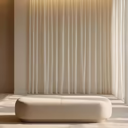 a light tan shade with a white curtain and bench in front of it