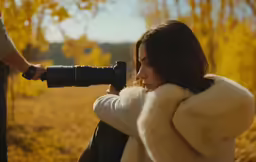 the girl is taking a photo of her surroundings