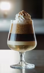 a dessert in a glass sitting on a table
