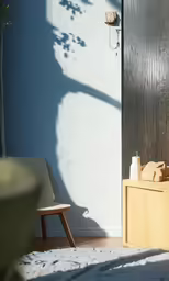 a white chair next to a wood table