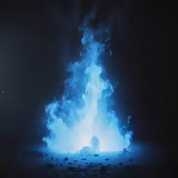 fire and smoke coming from a dark ground at night
