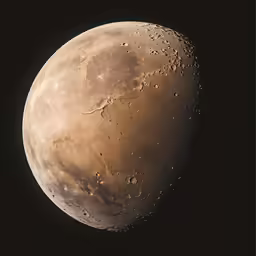 a close up of a very large moon with many drops on it