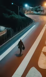 a man walking down the street at night