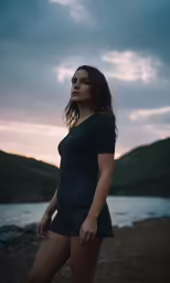 a girl posing at the beach wearing short shorts