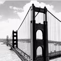 an aerial view of the golden gate bridge with a ferry