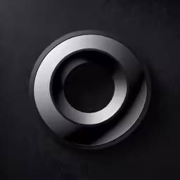 circular object with silver color on black background