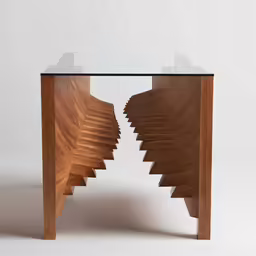 a wooden table with curved glass top