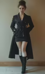 a girl in a long black coat and white socks