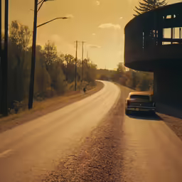 a long narrow road near an abandoned apartment complex