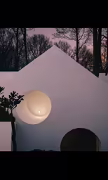 there is a white lite on top of a house