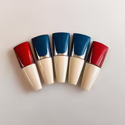 four long wearing lipsticks sitting in a row