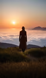 a woman standing in the middle of the woods looking at a beautiful sunrise