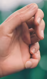 a small hand is resting on the palm