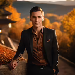 a young man in a business suit posing for a picture
