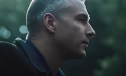 a man with a mohawk, staring at the camera
