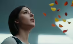 a woman looking up and looking to the sky