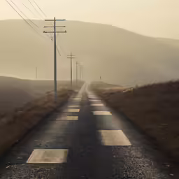 a long road with lines of cars on it