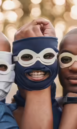 three people are wearing silly masks and scarves
