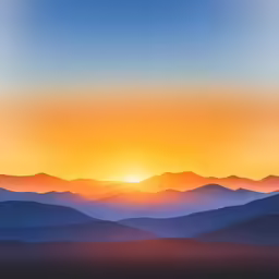 a view of the mountains at sunset from the top of a mountain