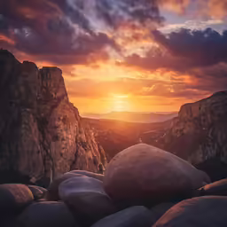 the sun is setting over rocky terrain at sunset