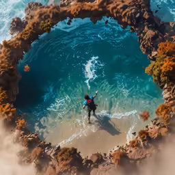 a surfer riding a wave through the water, surrounded by coral
