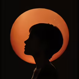 a woman with an afro looks into the distance