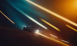 a black sports car in the middle of the night