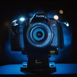 a camera sitting on top of a table next to a light