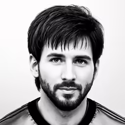 black and white photo of man in top knoted ponytail