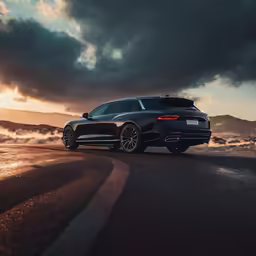 a black car is driving on the road