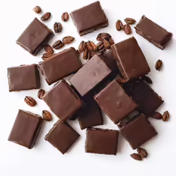 sliced up chocolates and almonds next to each other