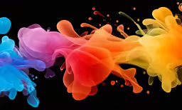 multi - colored ink floats in the dark with different colors
