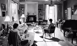 black and white photo of a woman sitting in her living room