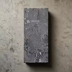 the book is on the concrete table
