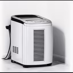 a small black and white air purigerator on the floor