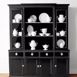 black china cabinet with white dishes and plates on it