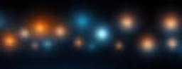 blurry image of a black wall with yellow and blue lights
