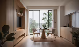 a living area with a tv, dining room table and windows
